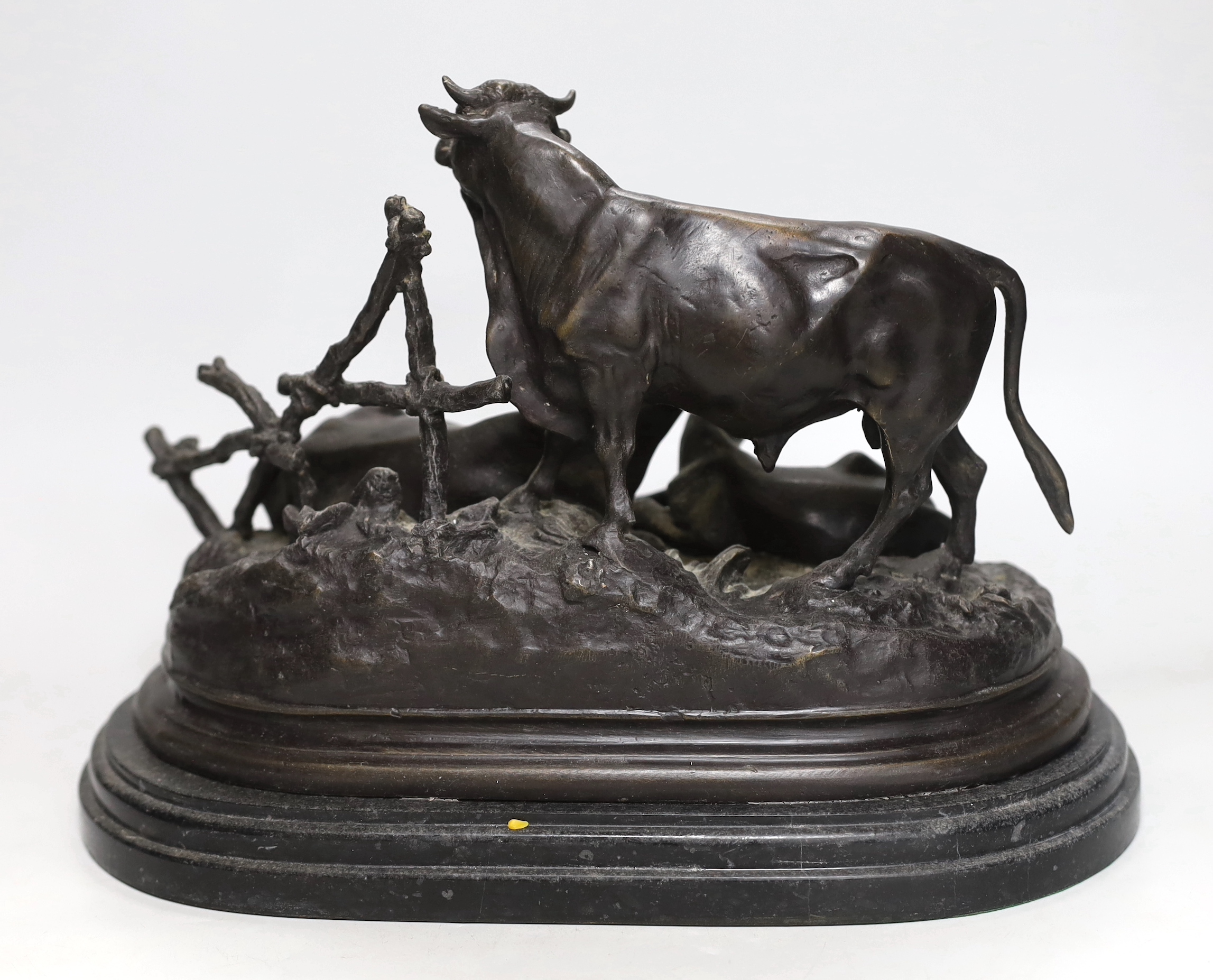 Jules Moigniez (1835-1894). A bronze figure group modelled as a bull, cow and calf upon naturalistically modelled ground. Signed J Moigniez, Length 39cm
